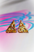 Load image into Gallery viewer, Triangular glittery earrings on a colorful abstract background